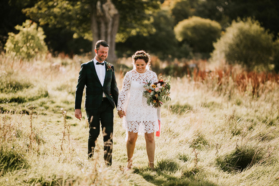 Laid back wedding ceremony in an Edinburgh back garden with DIY decor and bride wearing lace boohoo dress