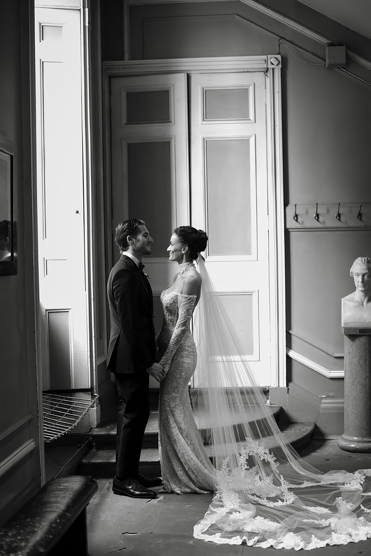 Black and white couple portrait at The Signet Library Edinburgh showing lace wedding dress train
