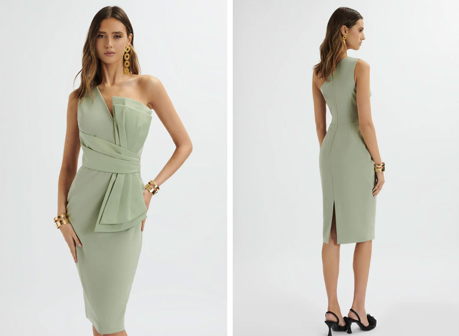A woman wearing a knee-length sage green dress and black high heels