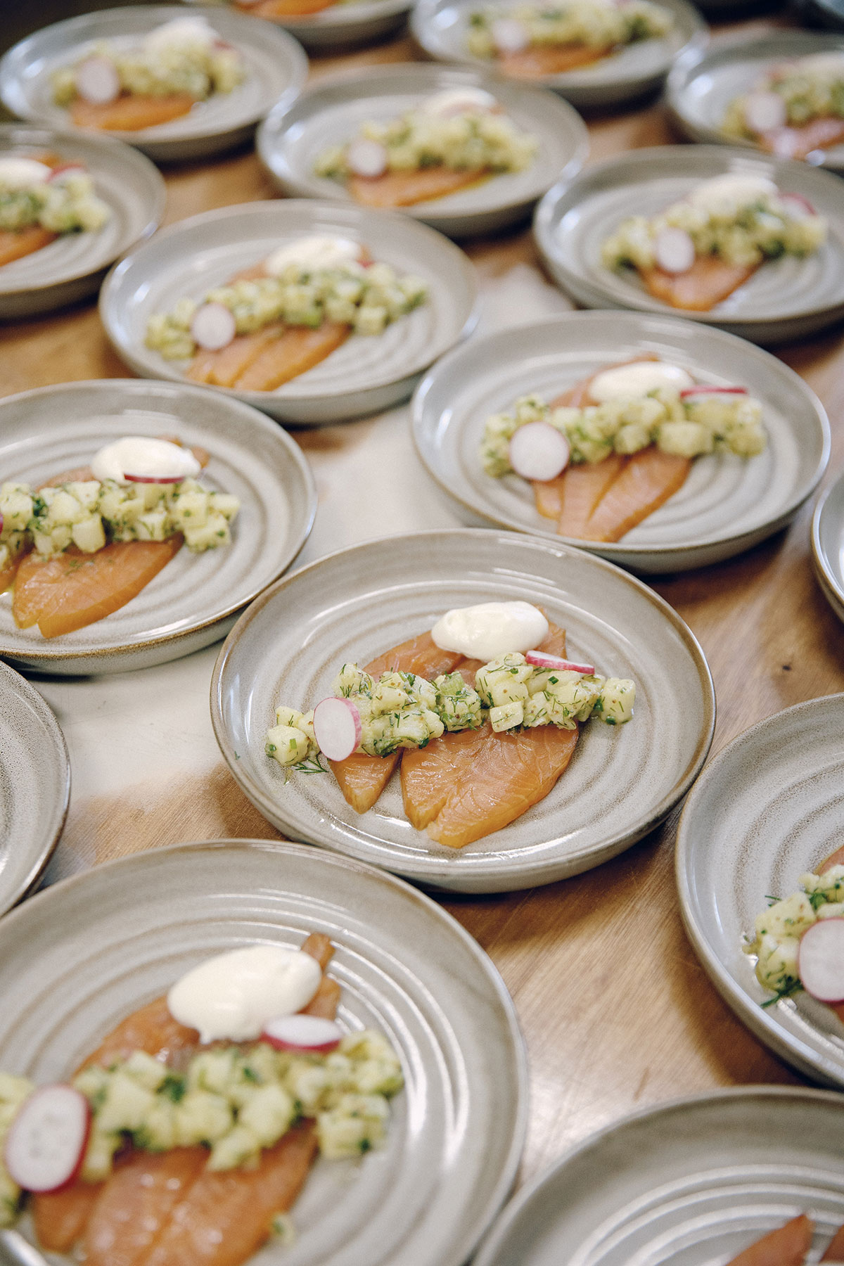 Plates of smoked salmon starter prepared for wedding meal at Gilmerton House reception