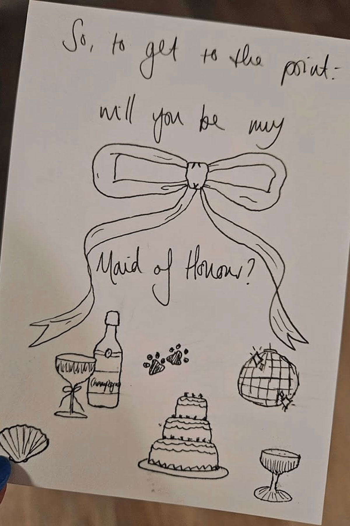 card asking to be maid of honour with wedding related doodles