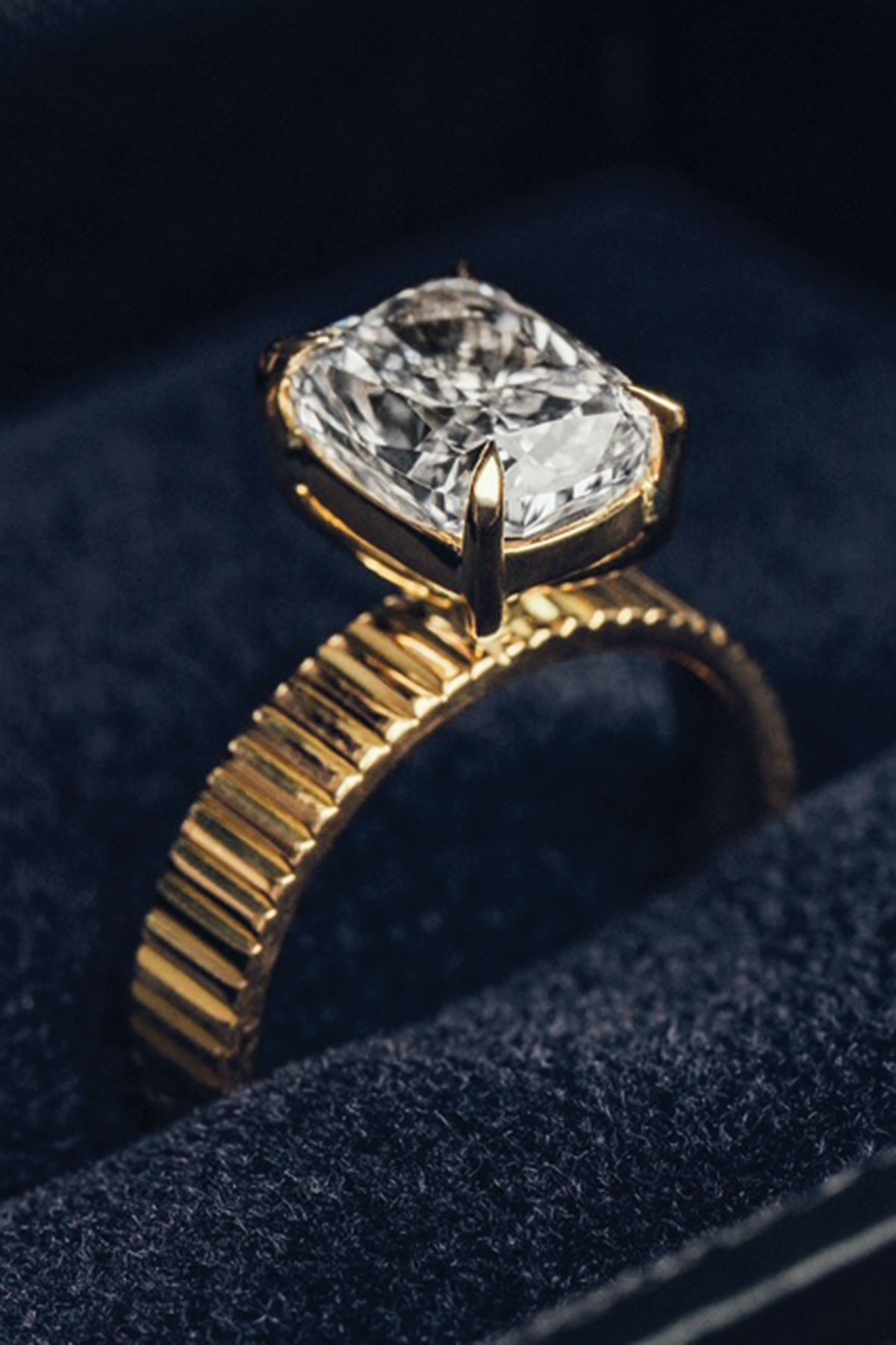 Bespoke gold engagement ring with a large cushion-cut stone by James Porter & Son