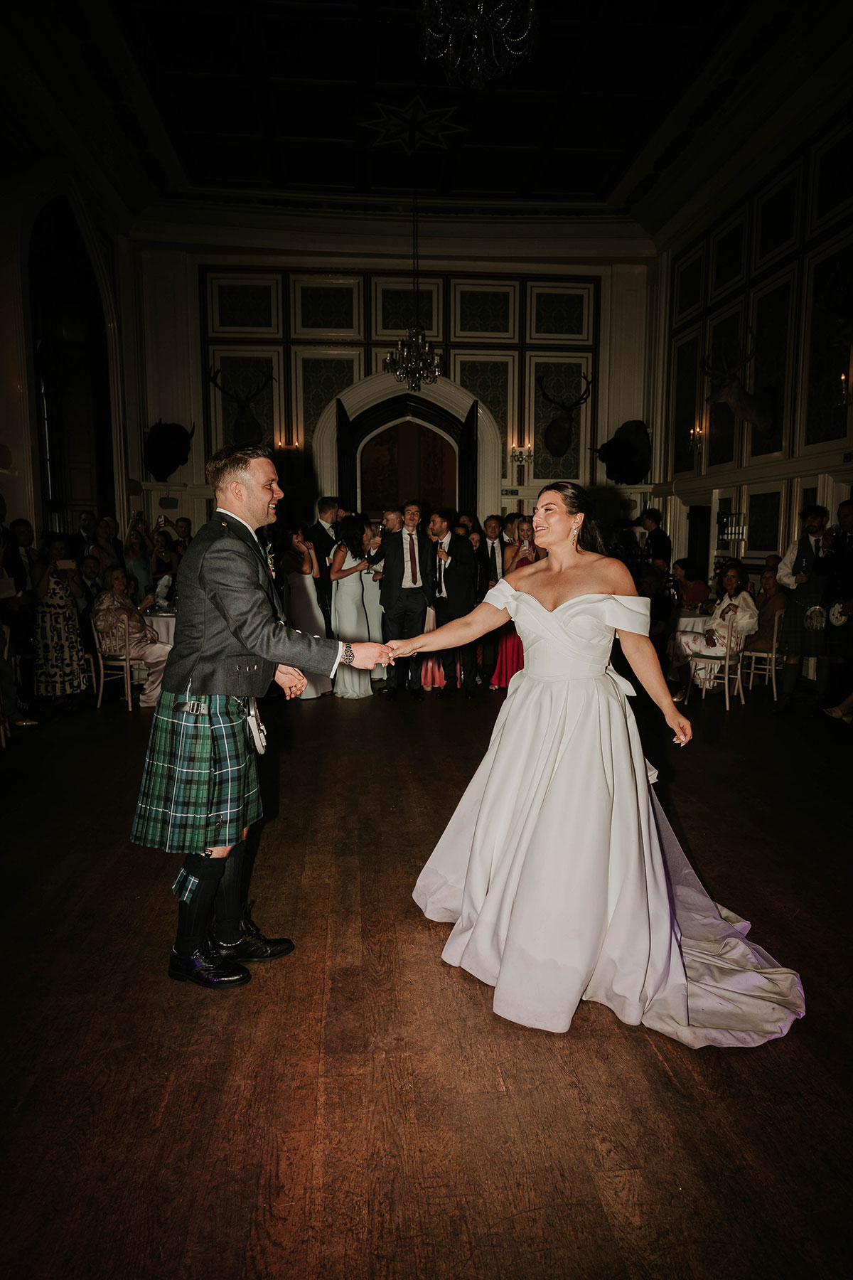 Bride and groom first dance in ballroom at Drumtochty Castle Aberdeenshire wedding reception
