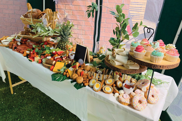 Grazing table set up with savoury and sweet food