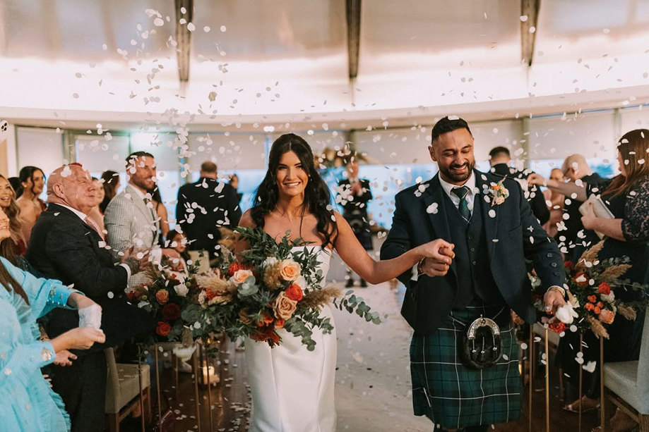 A confetti shower inside the Waterlily Suite at The Vu central Scotland sustainable wedding venue