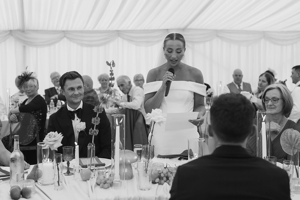 Bride giving a wedding speech during marquee reception on family farm in Ayrshire