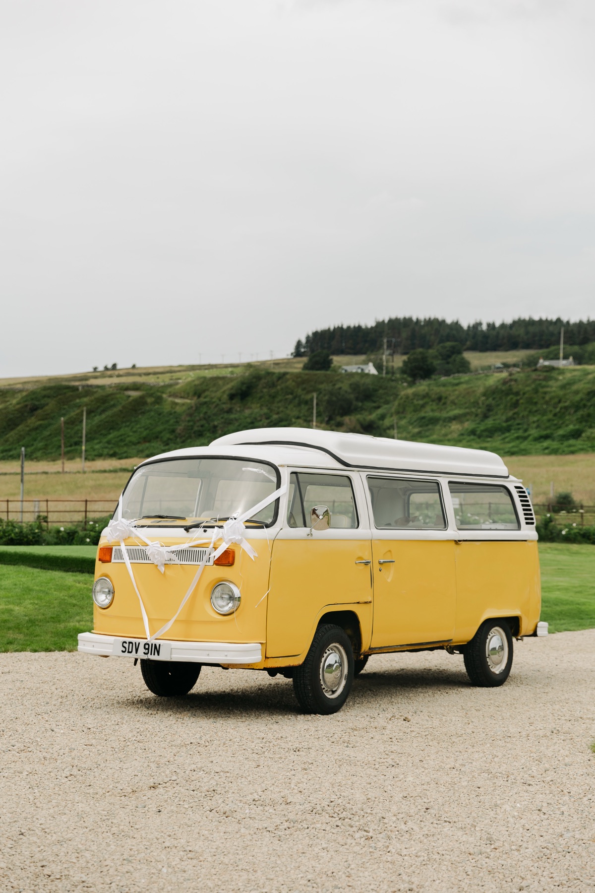 Yellow vintage VW campervan decorated for Gary and Isobel’s wedding at The Dougarie Boathouse on Arran.