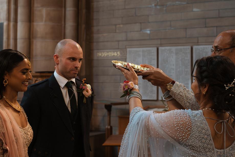 Hindu Blessing of a bride and groom during A Wedding Ceremony At Glasgow University Memorial Chapel