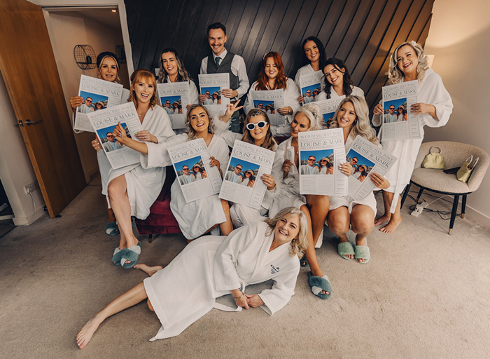 Women sitting on couch with newspapers