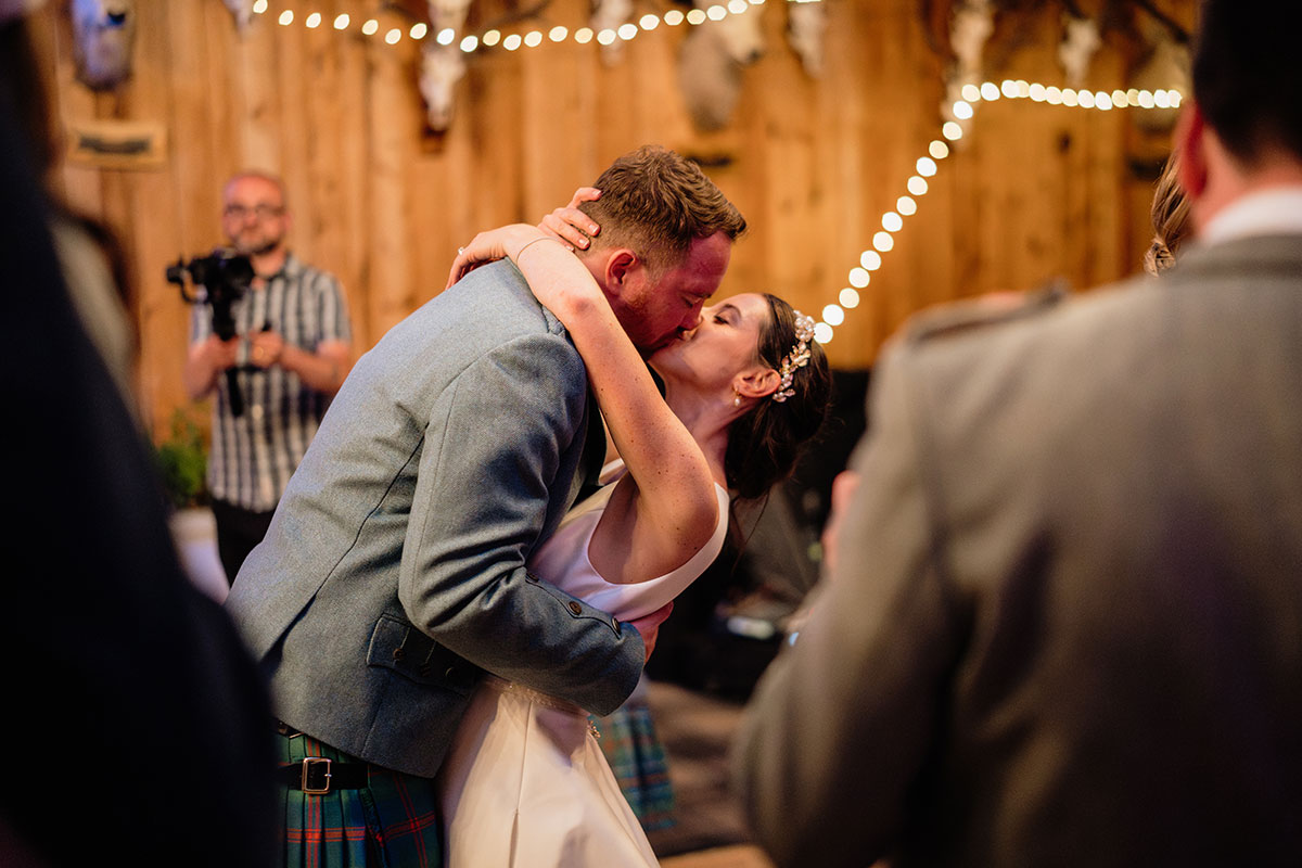 Bride and groom sharing their first dance during their wedding reception at Mar Lodge Estate in the Scottish Highlands