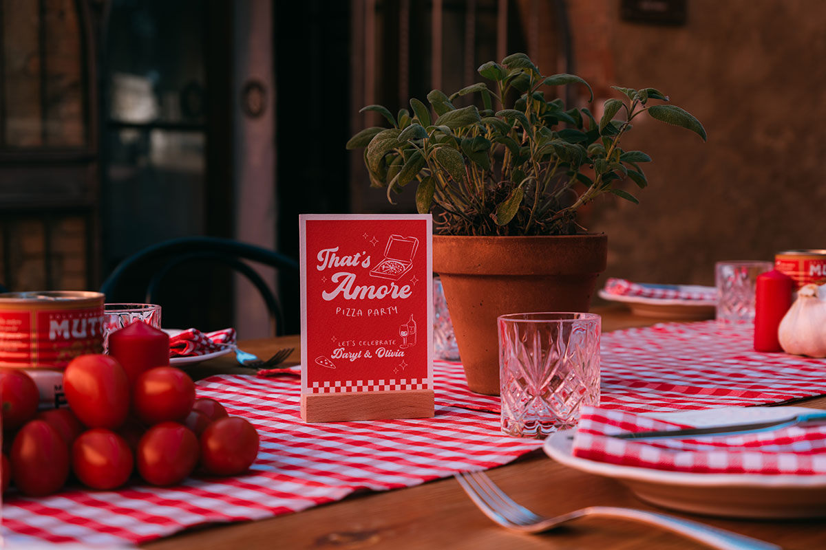 Pizza party wedding table with “That’s Amore” menu signage at Antico Borgo San Lorenzo Tuscany