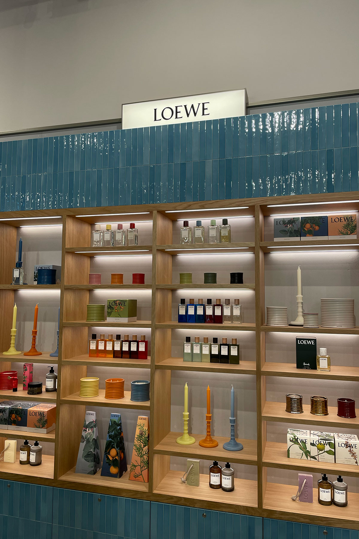 LOEWE fragrance, candle and home scent display on wooden shelving at H beauty Silverburn.