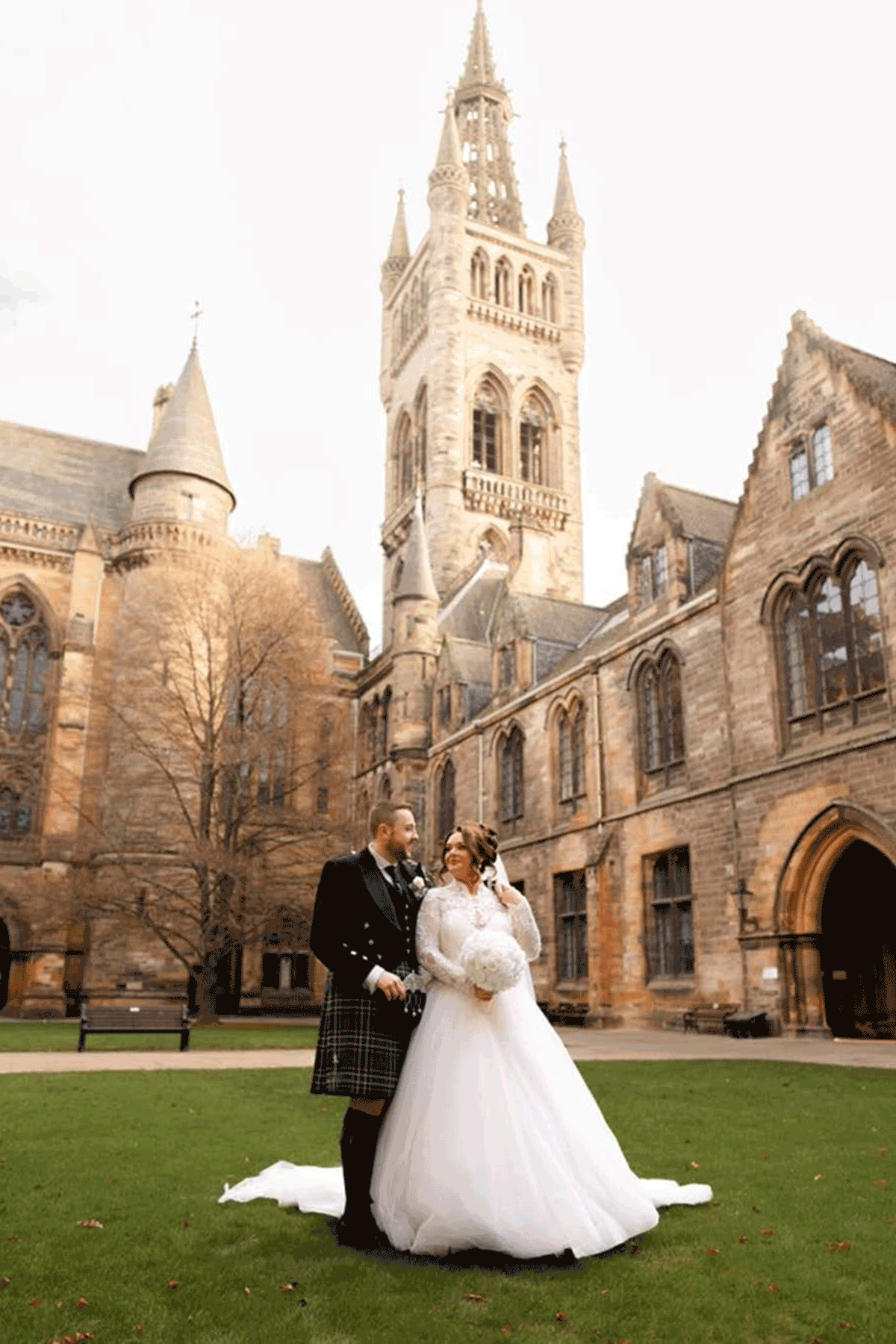 Couple standing on the lawn of glasgow university
