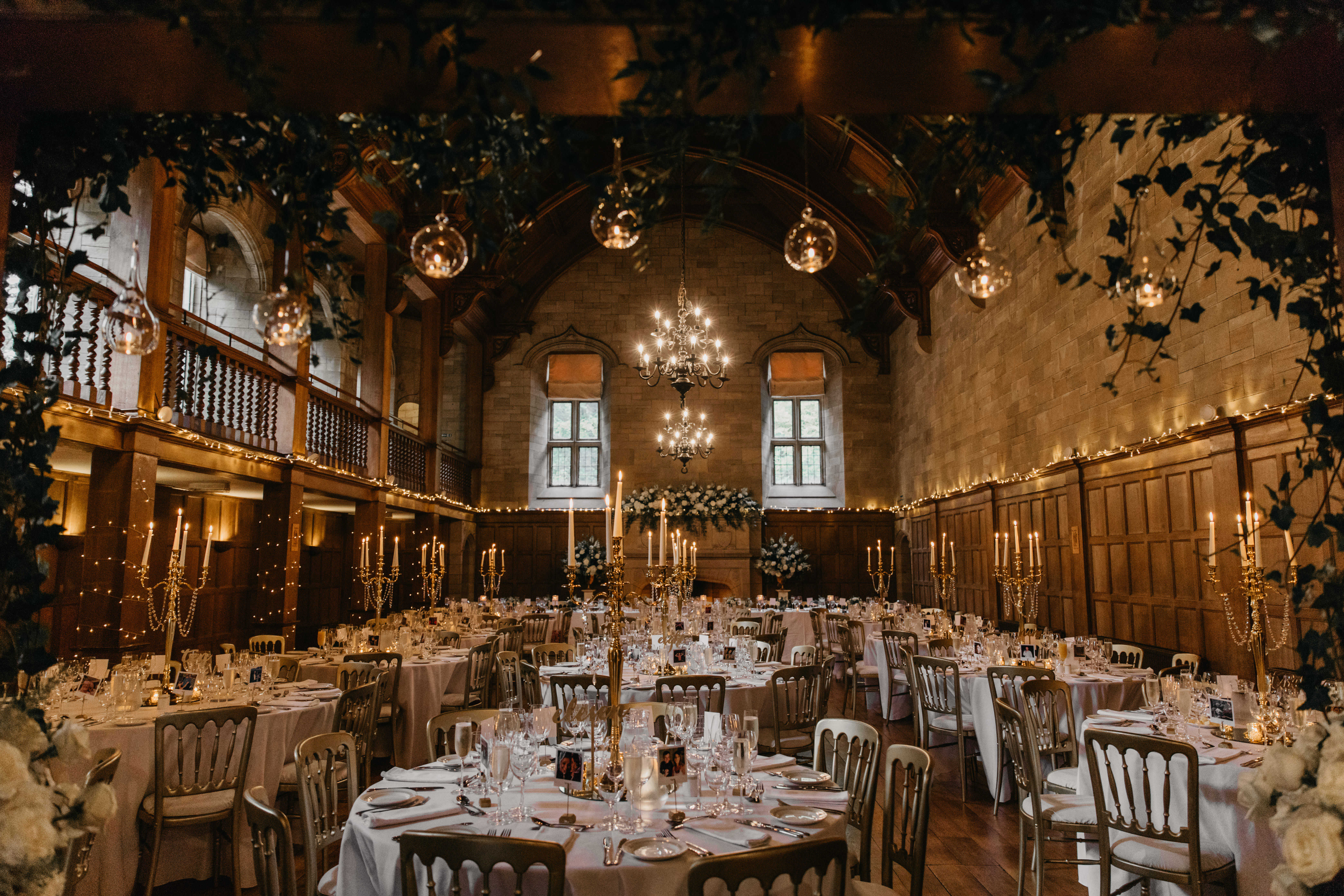 Achnagairn Castle Ballroom Tables with tall candle centrepieces set up for wedding dinner