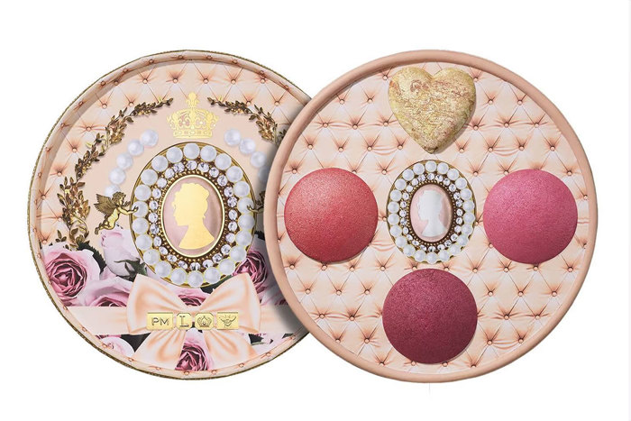 A makeup palette with four colours, three in shades of pink and one gold