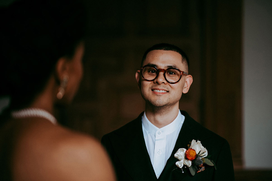 Groom faces bride during ceremony