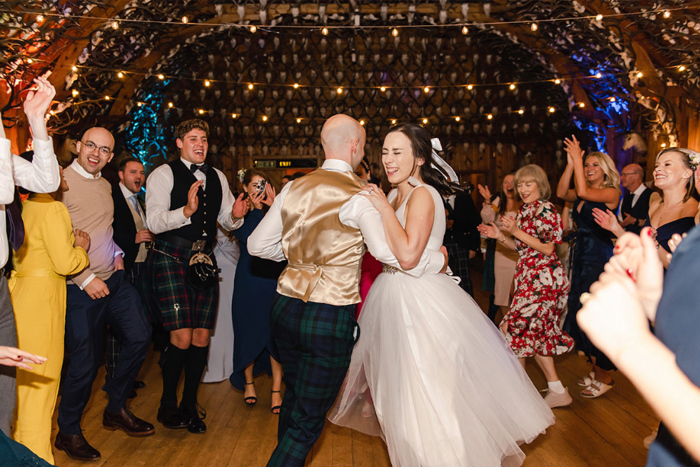 Bride and groom look pleased as they take to the dancefloor