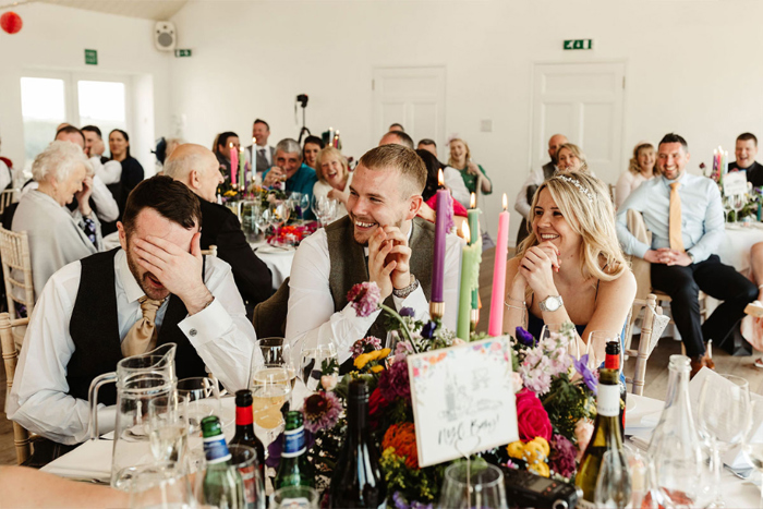Guests laugh at their table