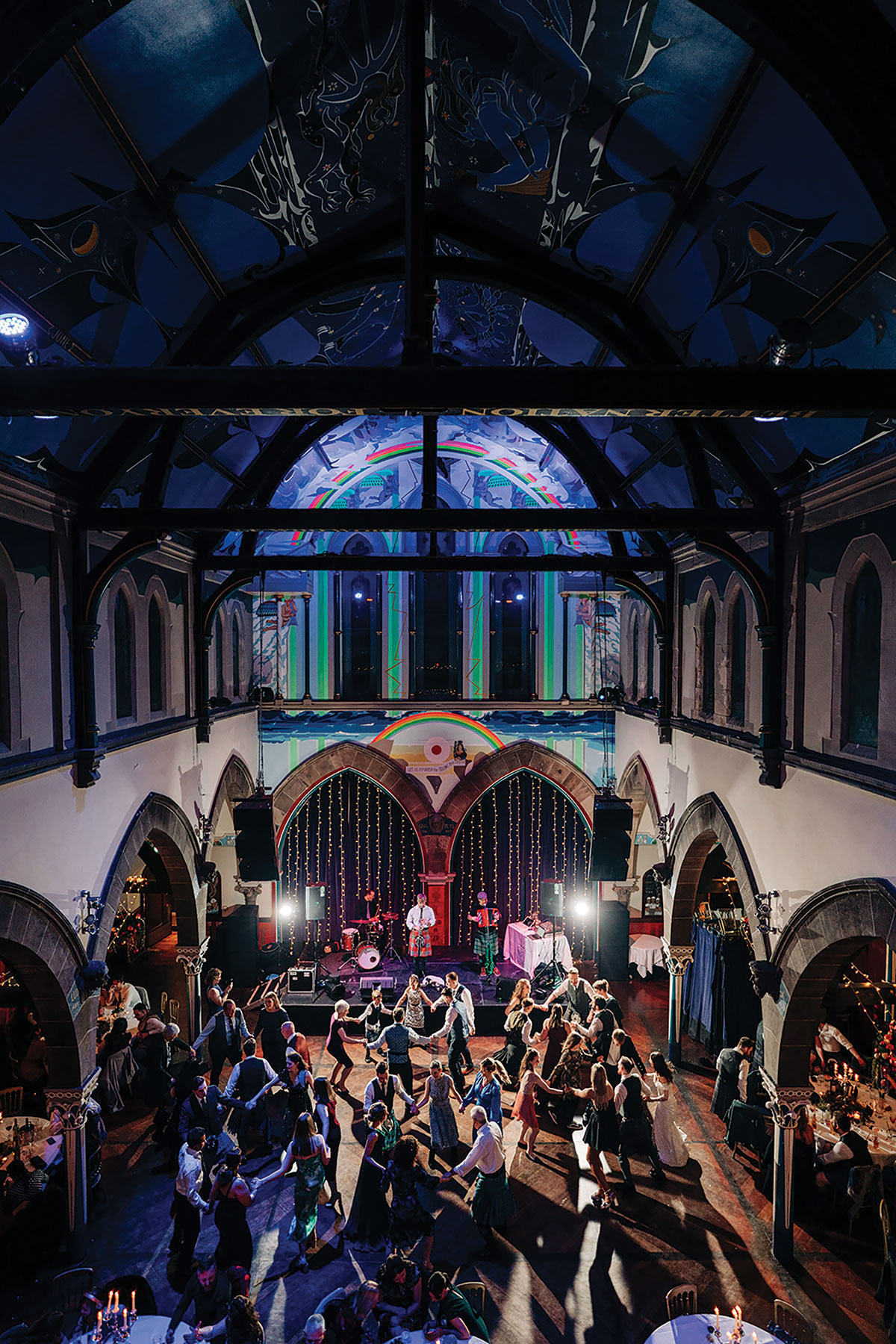 wedding guests dance in a circle at oran mor