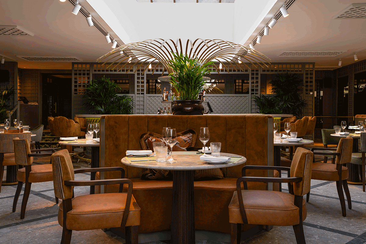 Foveran's bar at crossbasket castle with leather seating and green plants