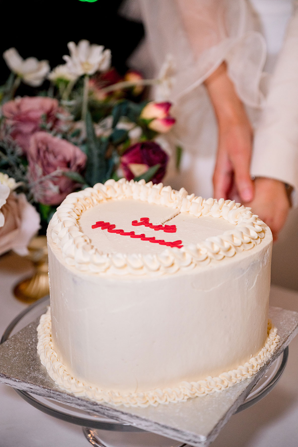 White heart wedding cake with red lettering, modern Glasgow wedding details