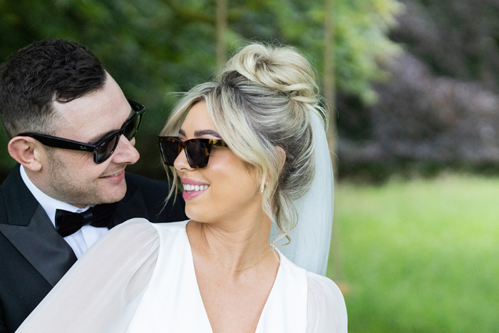 Bride And Groom Portraits wearing sunglasses