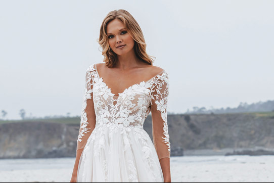 floral applique wedding dress on a blonde bridal model