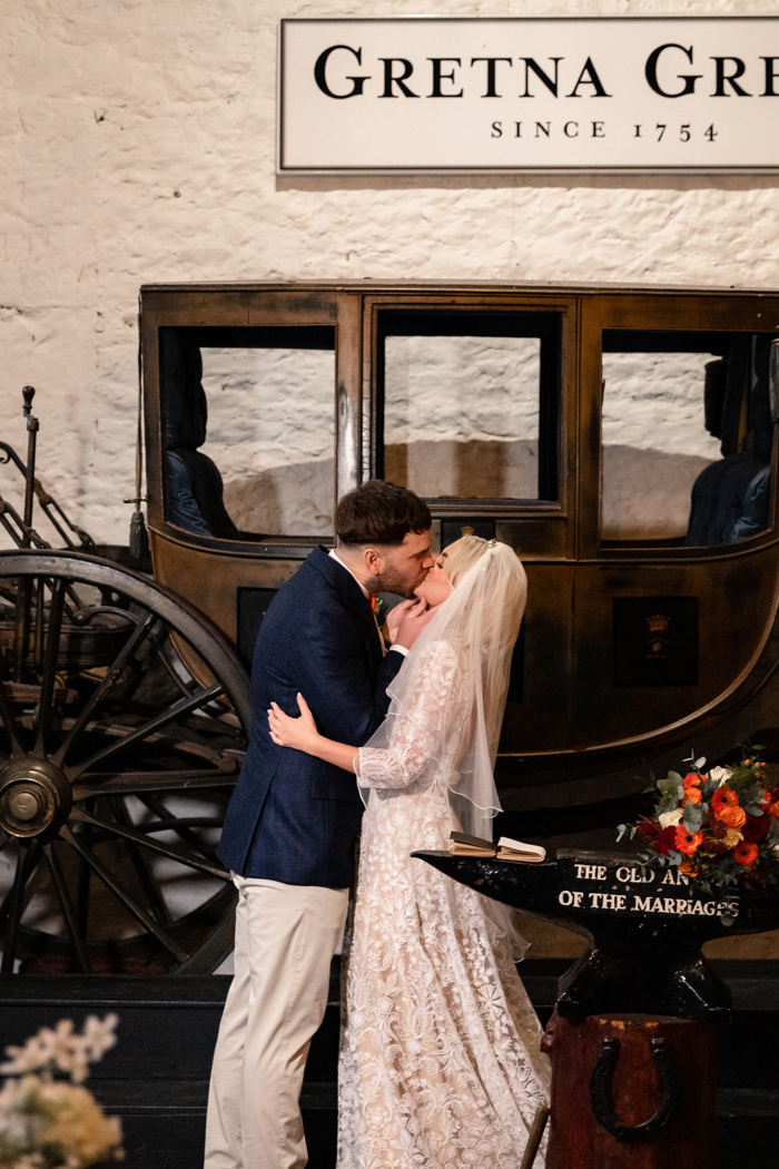 couple kiss after getting married at gretna green