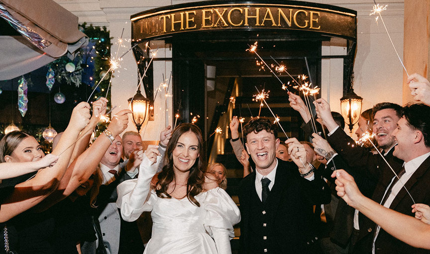 a bride and groom sparkler procession outside Glasgow wedding venue The Exchange