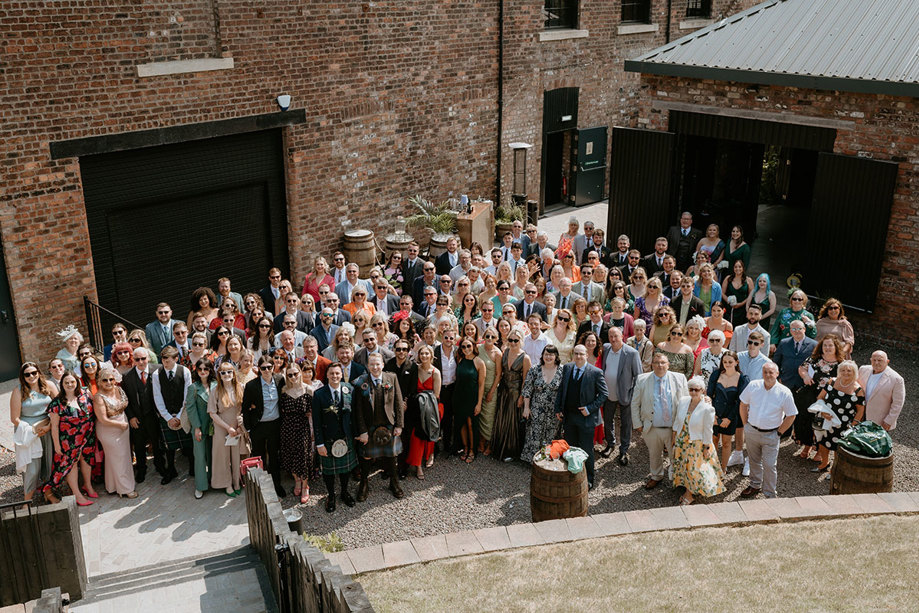 Aerial Image Of Wedding Guests Posing At The Engine Works