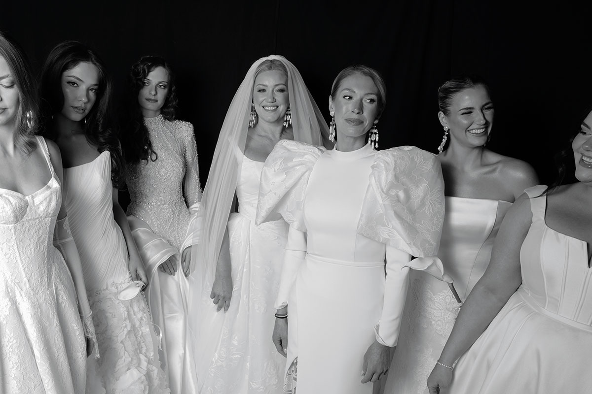 line up of models in wedding dresses pictured backstage at The Scottish Wedding Show