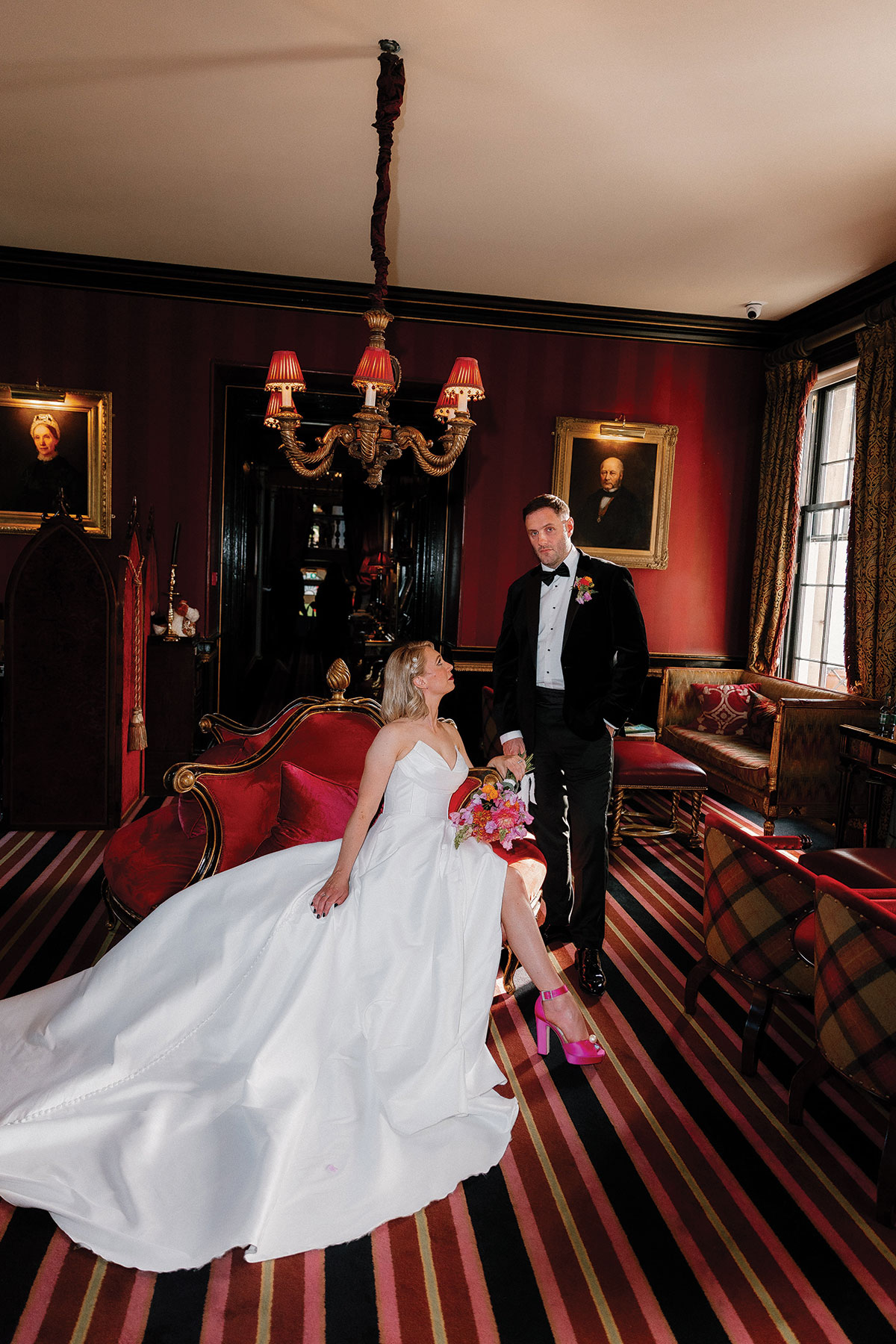 Bride and groom portrait inside Prestonfield House Edinburgh featuring dramatic interiors and colourful styling