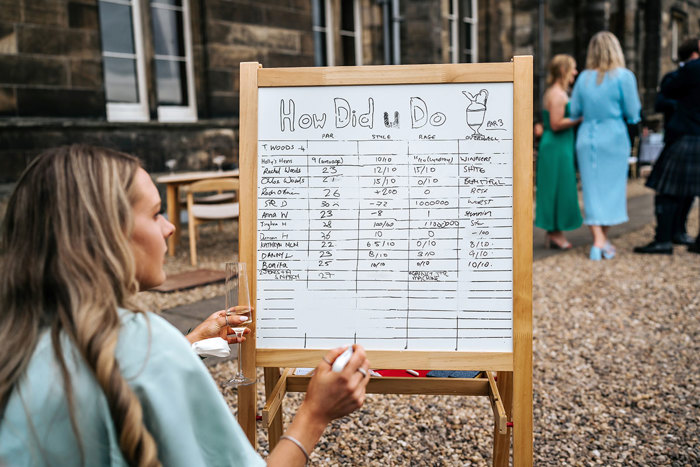 white board with list of crazy golf winners at mar hall