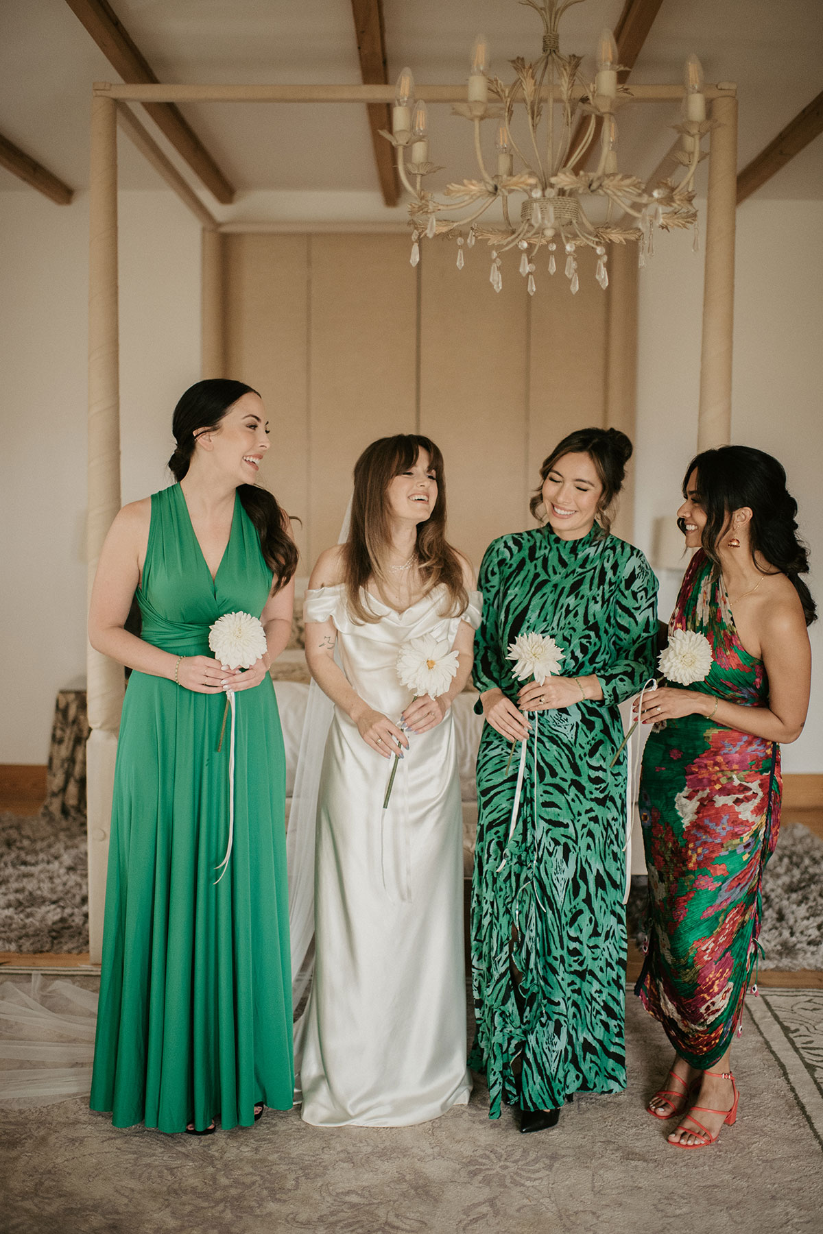 a bride with bridesmaids in a bedroom at Achnagairn Castle