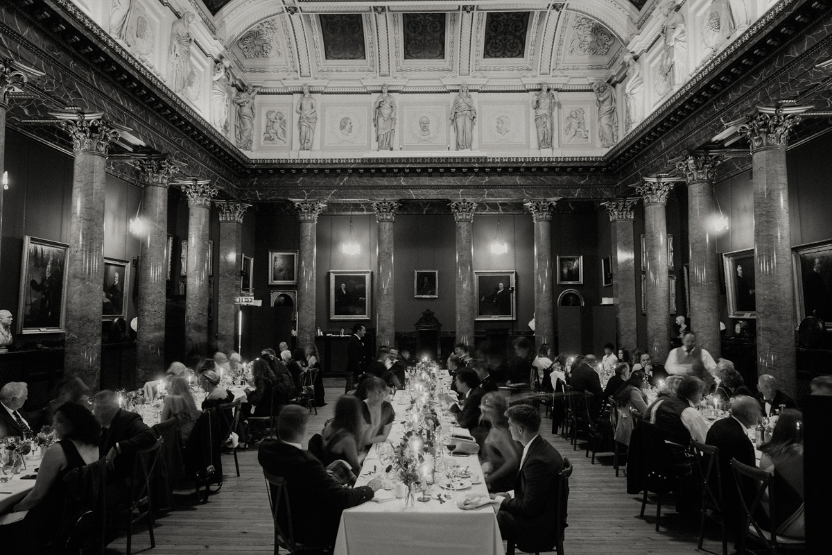 Wedding dinner in the grand hall of the Royal College of Physicians Edinburgh with candlelit long tables