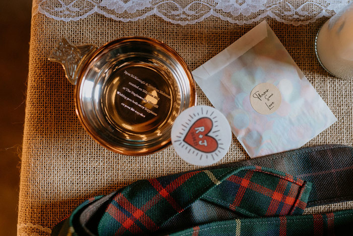Silver Engraved Quaich, Love Heart Sticker And Tartan On Hessian Background