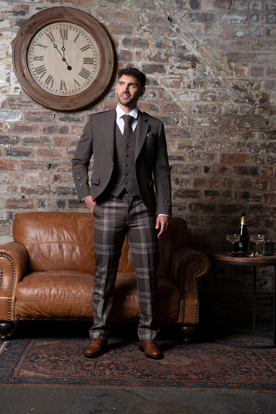 A person wearing a Jura Mist tartan trews outfit from MacGregor and MacDuff.