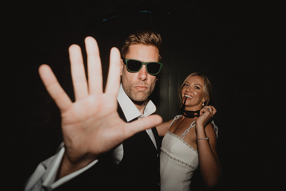 Bride And Groom Holding Hand Up