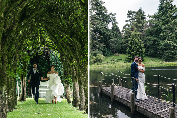 a newlywed bride and groom walk on grass below an avenue of trees on left and pose on a wooden pier on right at Blairquhan Castle