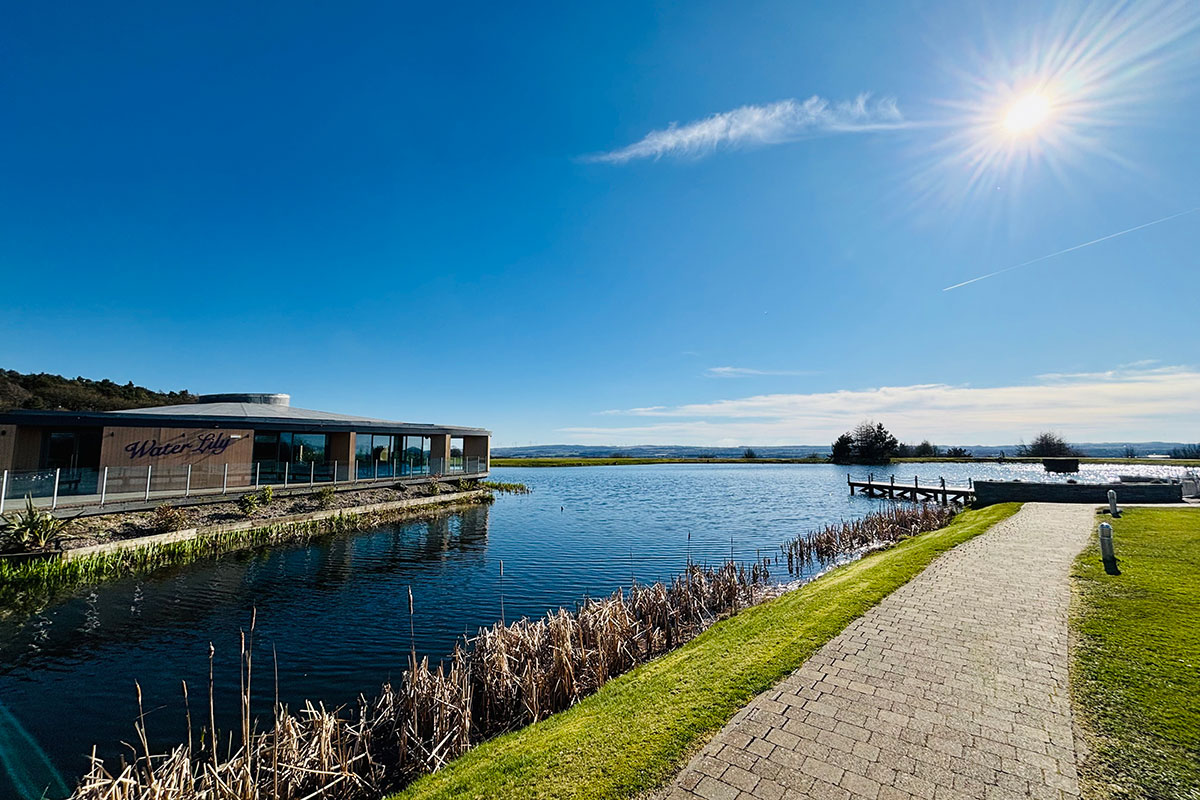 Exterior of the Waterlily wedding venue at The Vu beside the reservoir on a sunny day