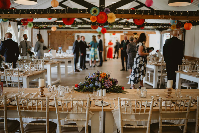 View of the reception room and its brightly coloured decorations from the top table
