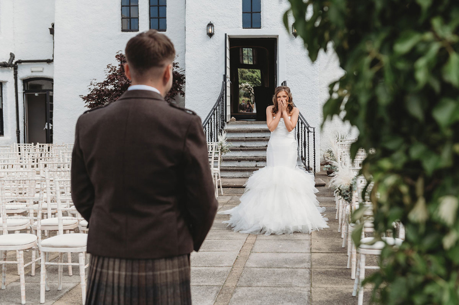 Bride reacts during couple's first look