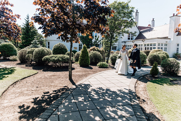 Bride And Groom Walking In The Grounds At Lochgreen House Photo By Tandem Photo