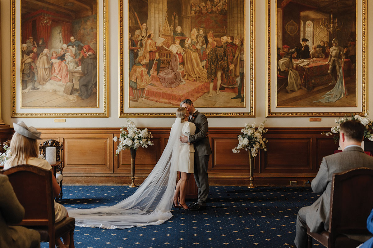 Bride and groom kissing during their Edinburgh City Chambers wedding ceremony