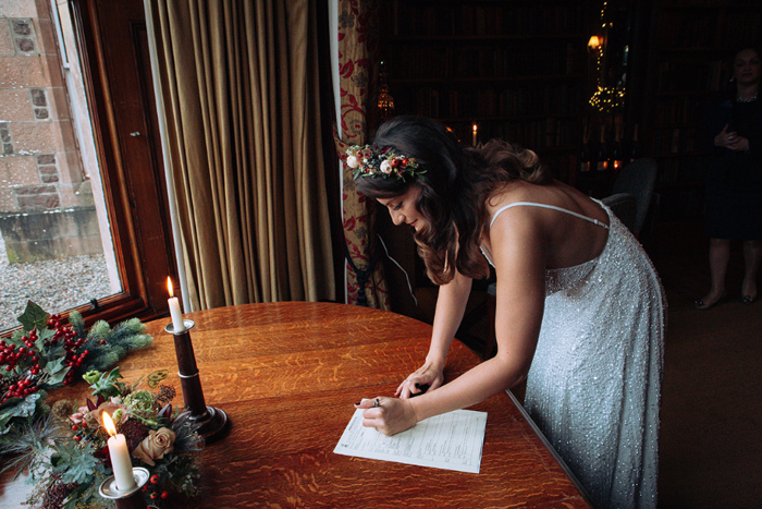 Image showing bride signing documentation