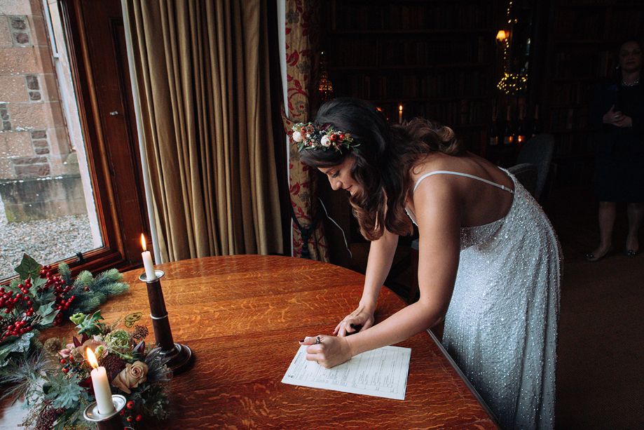 Image showing bride signing documentation
