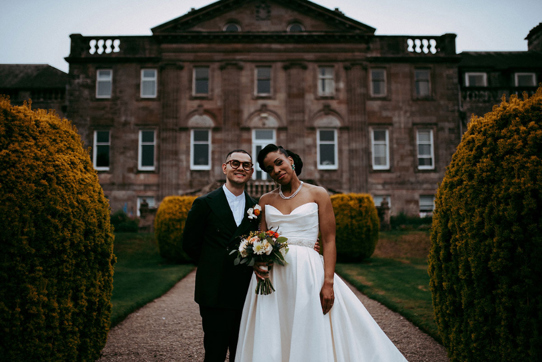 Bride and groom outside Springkell House