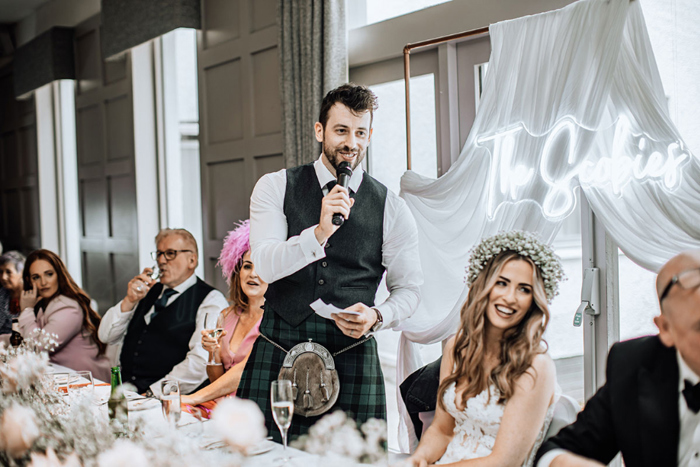 Groom gives speech during wedding