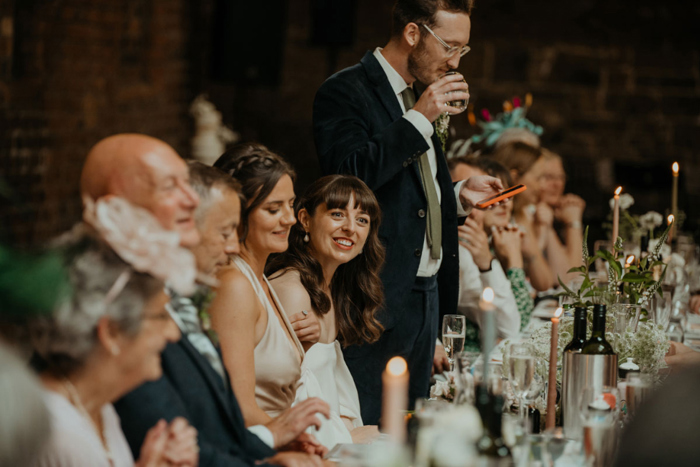 Top table smiling during groom's speech