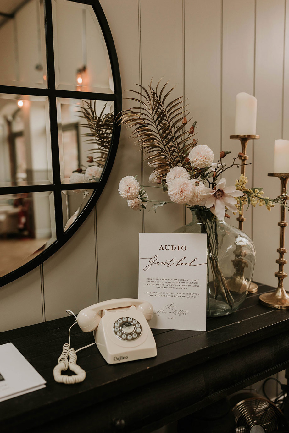 an audio guest book cream old-style phone by Calleo with flowers, mirror and candlesticks